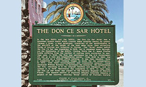 Green plaque with information about the Don CeSar Hotel