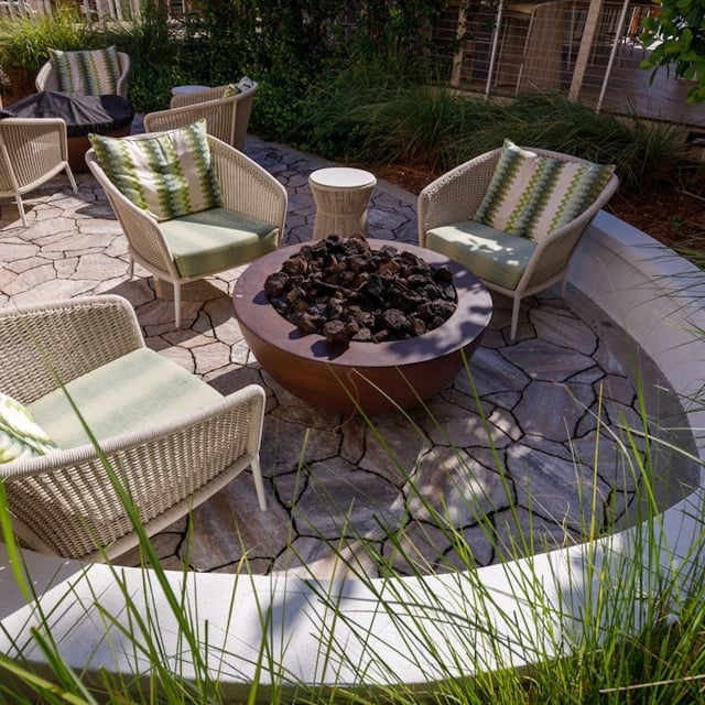 outdoor seating area with charcoal fire pit