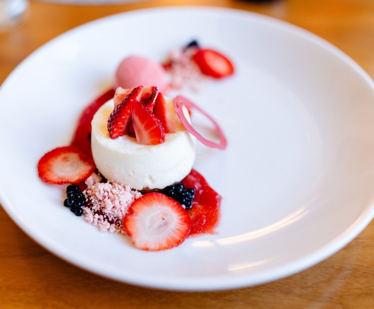 Small slice of cheesecake garnished with berries