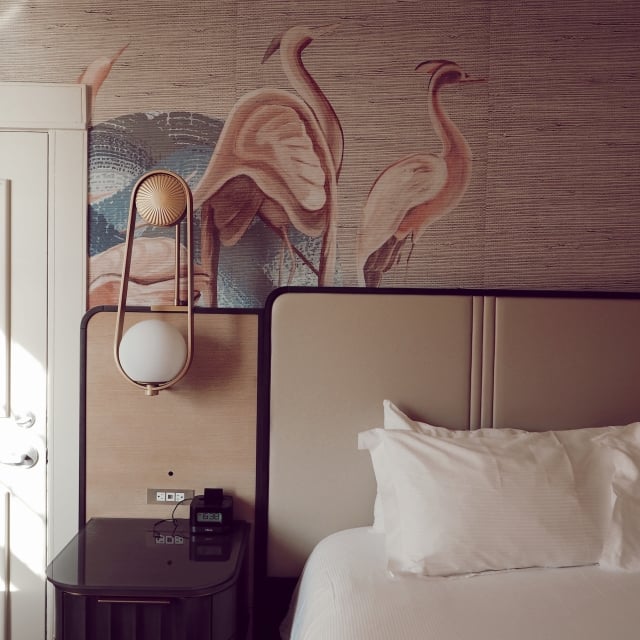 bedroom with flamingo wall paper