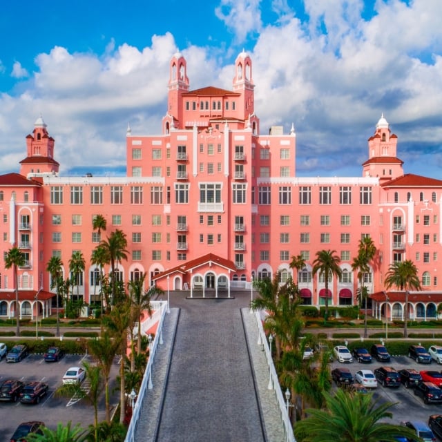 parking lot of a pink hotel