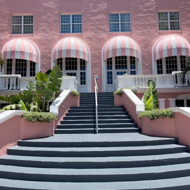 pink stairway leading to the courtyard