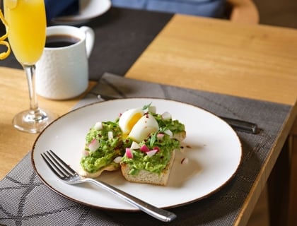 Avocado toast with radish and soft boiled egg