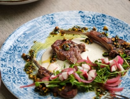 A plate of food sits on a table, showcasing a colorful and appetizing meal ready to be enjoyed.