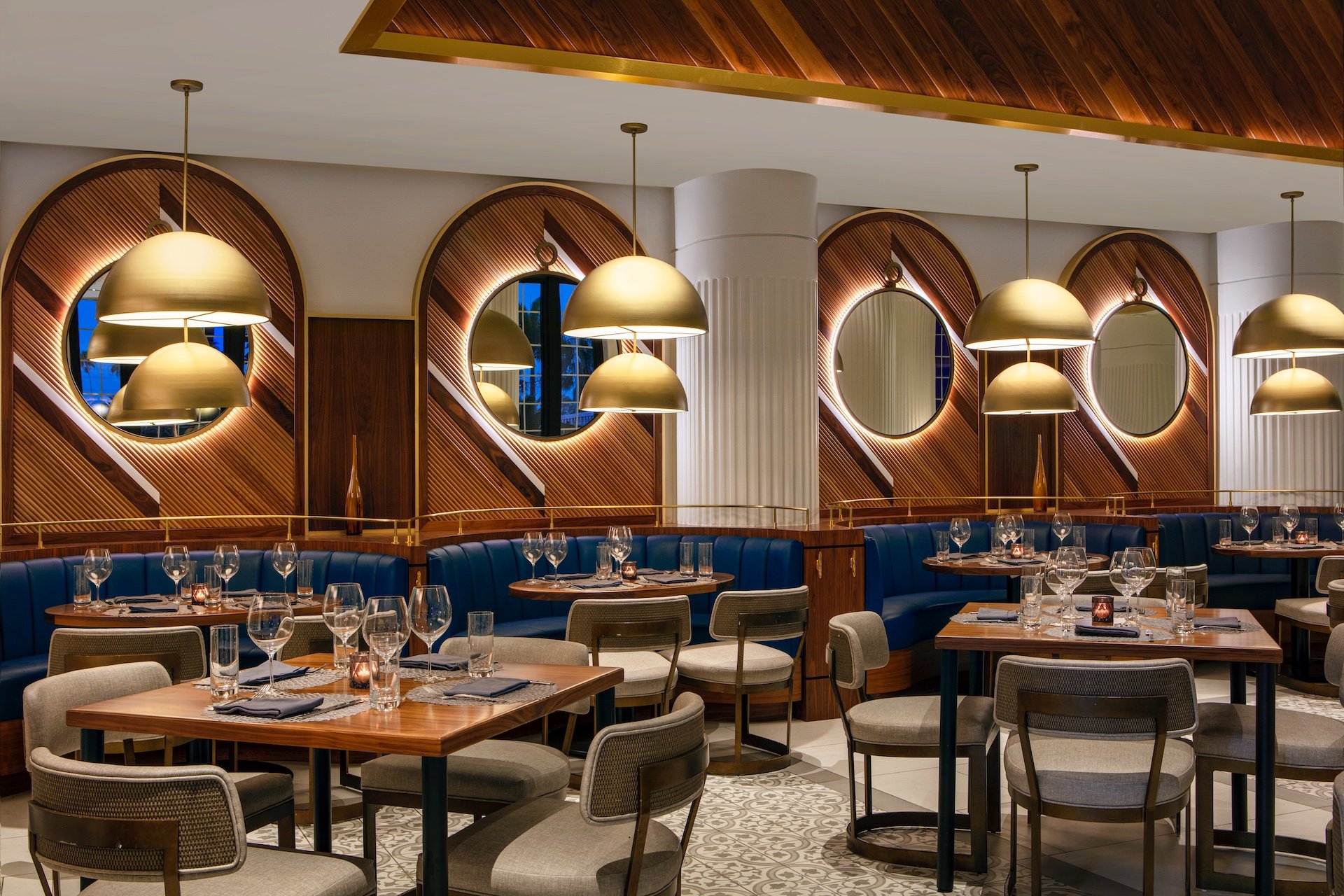 dining area with blue booths and wooden walls