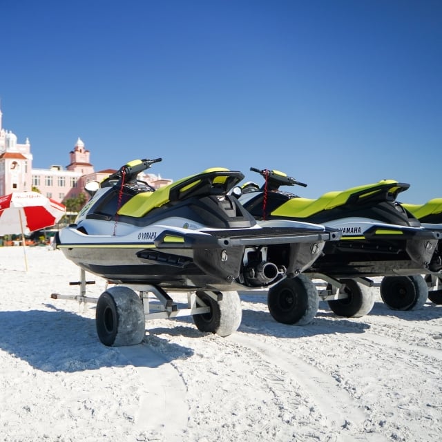 Two sea doos on the beach in front of The Don CeSar