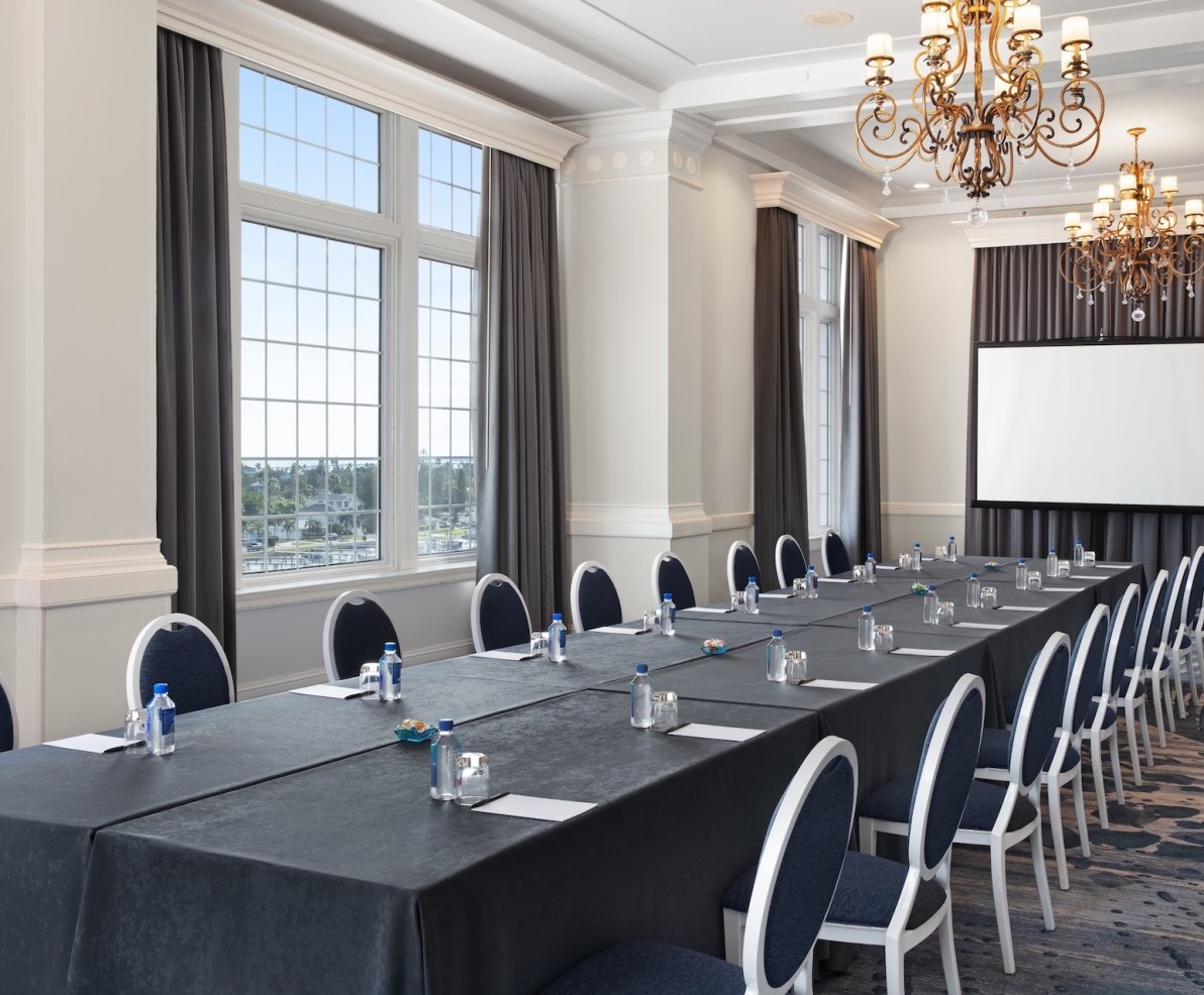 Room with a long table set up for meeting