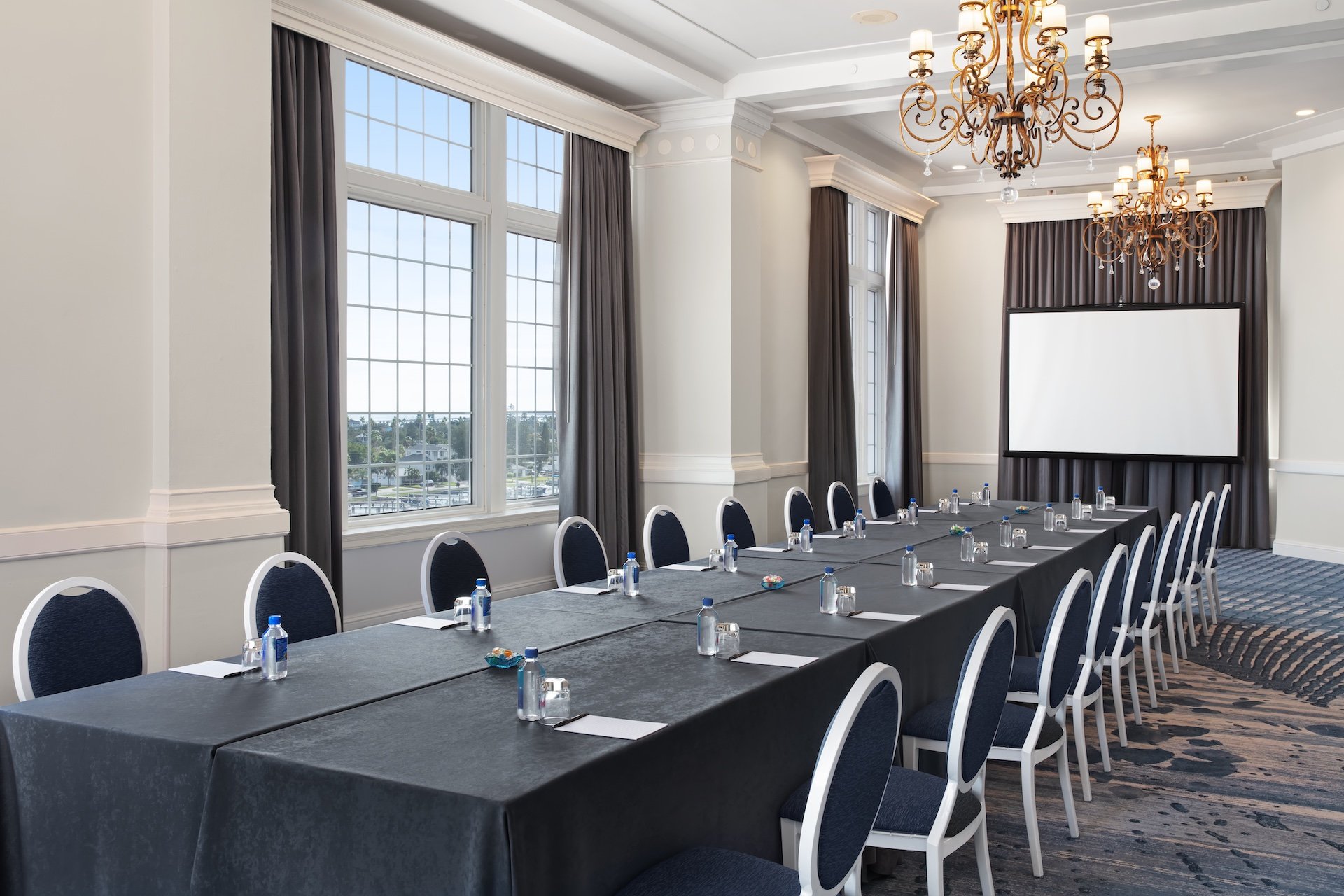 Room with a long table set up for meeting