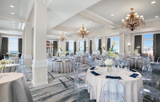 meeting room with round tables and ocean view