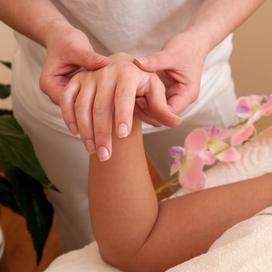 Hand massage in spa salon