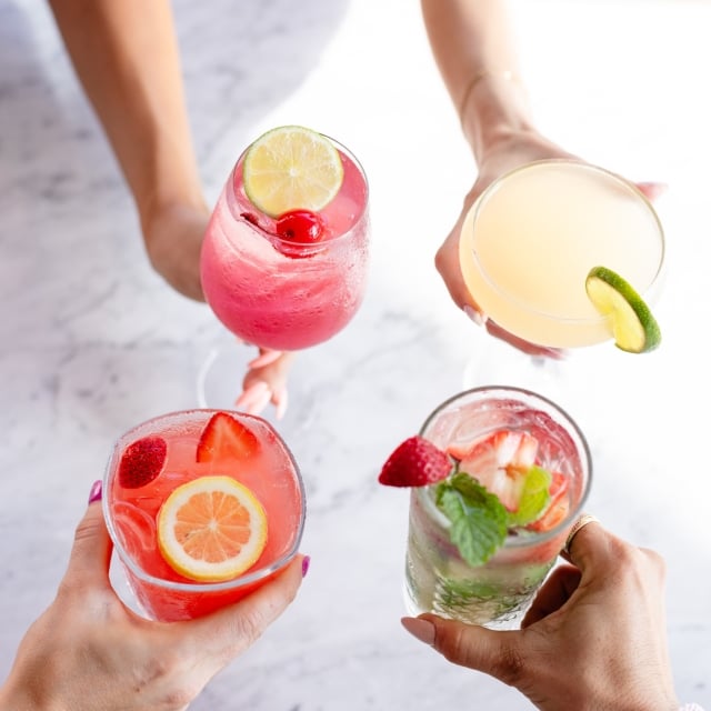 four colorful cocktails