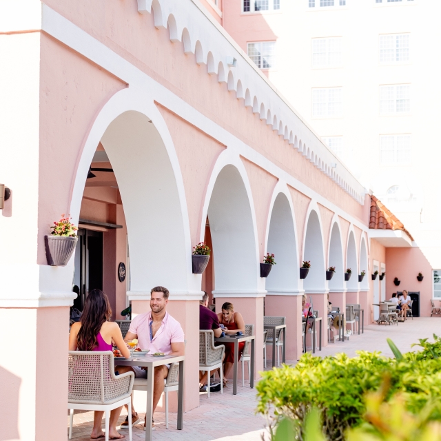 people eating on an outdoor patio