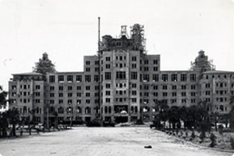 black and white photograph of the construction phase of the hotel