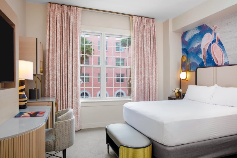 bedroom with small desk and view of the courtyard