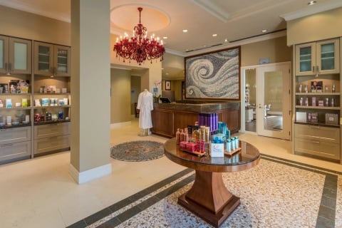 spa entrance with various shelving units displaying wellness products