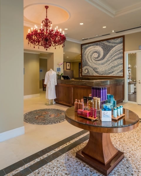 spa entrance with various shelving units displaying wellness products