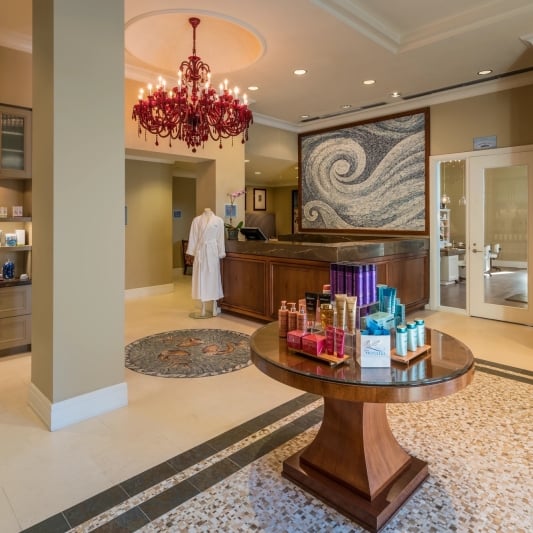 spa entrance with various shelving units displaying wellness products