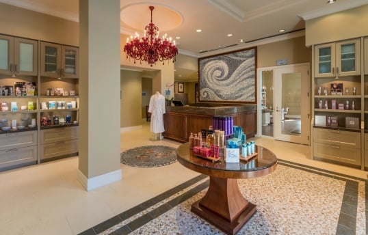 spa entrance with various shelving units displaying wellness products