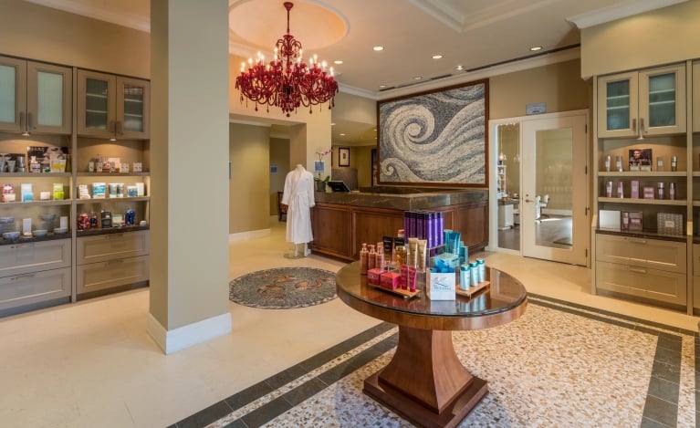 spa entrance with various shelving units displaying wellness products