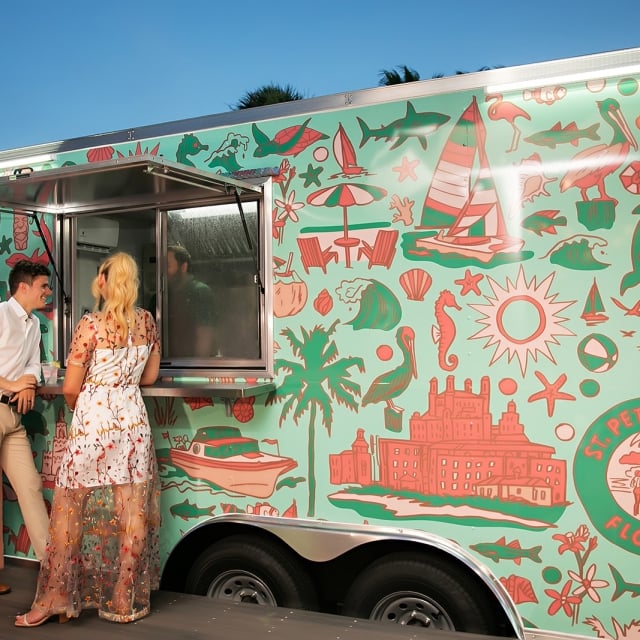 a couple waiting at a food truck