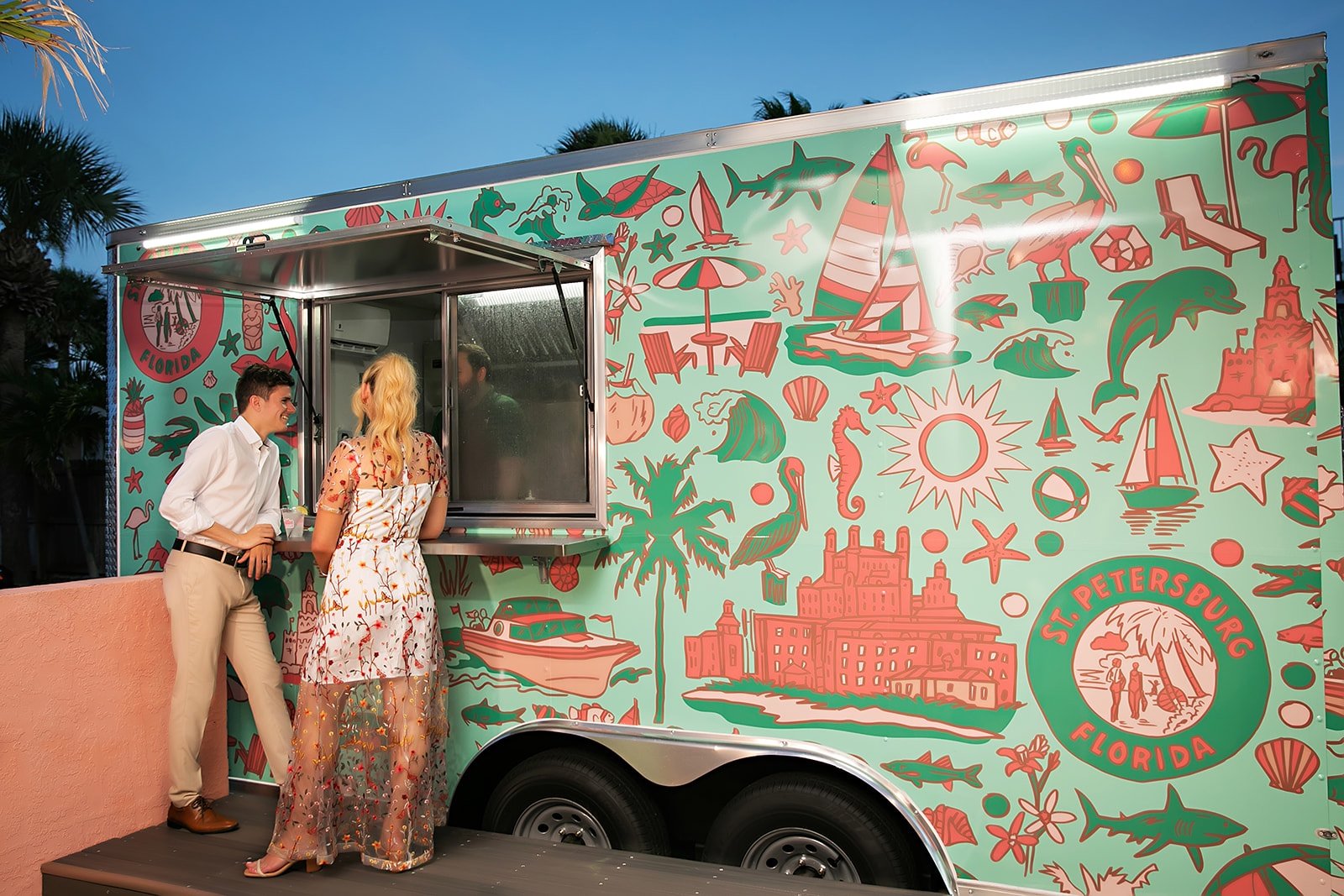 a couple waiting at a food truck