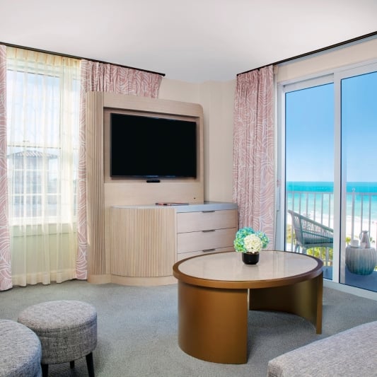 living room with grey couch and balcony