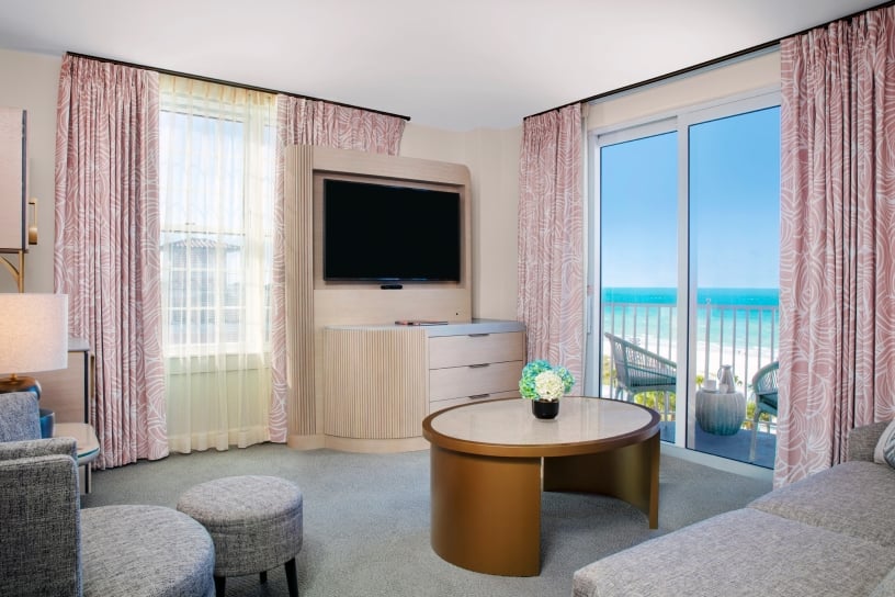 living room with grey couch and balcony